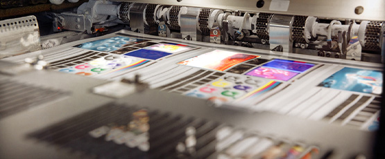 vibrant image of a printing machine involved in the process of business catalogue production